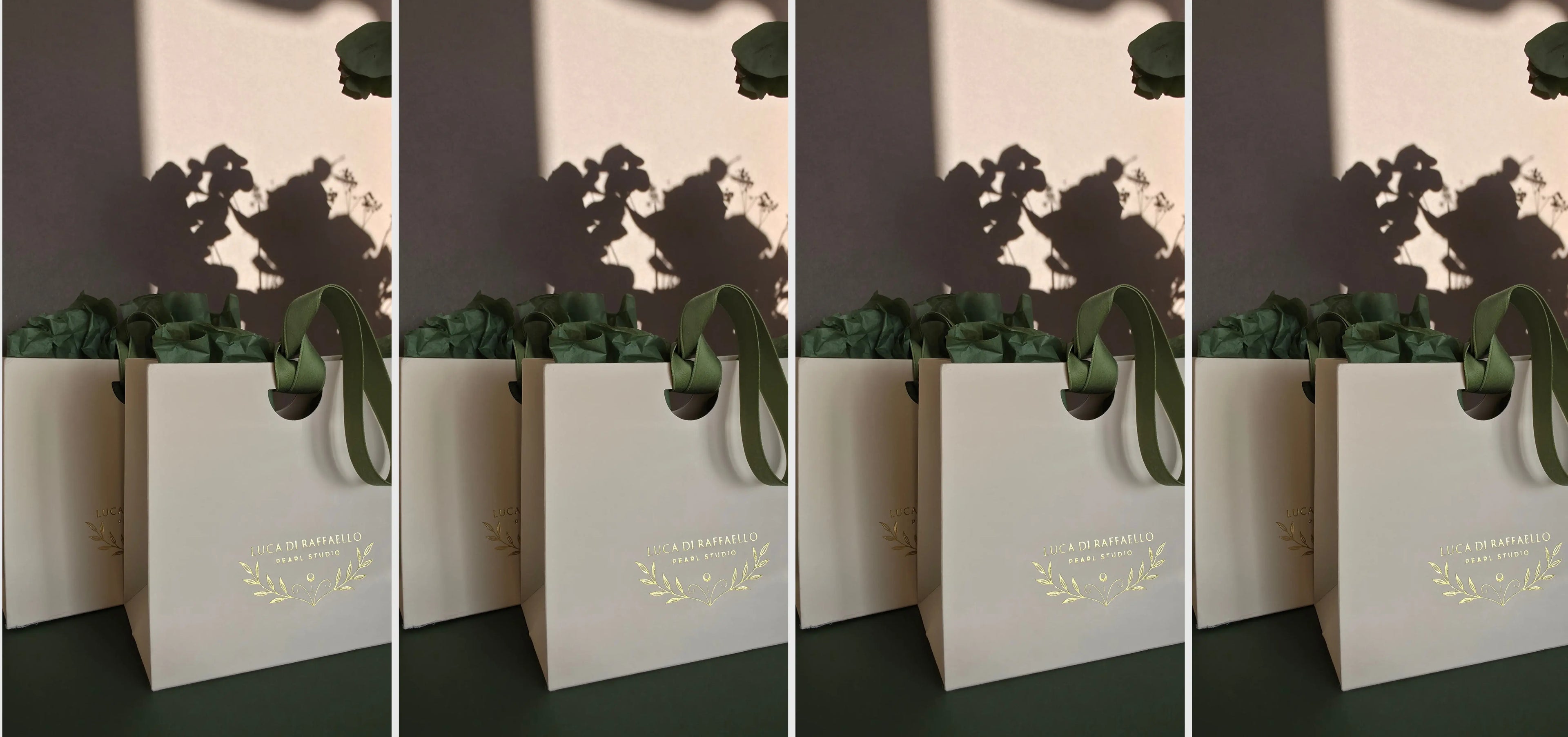 Cream gift bag branded "Luca di Raffaello" with green floral design and text on a brown background.